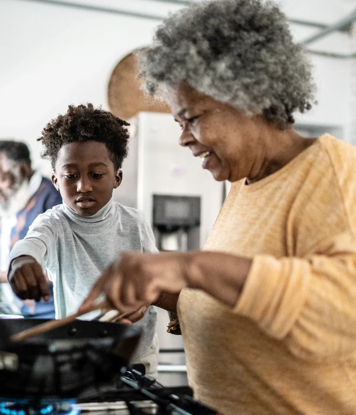 Grandmother and grandchildren cooking together